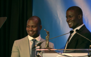 UN Ambassador Victor Ochen presents Aegis Regional Director Freddy Mutanguha with the inaugural Peace, Justice and Security Award in the Hague, 5 Sept 2016