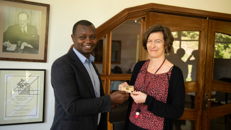 HE Helena Rietz receives Ubumuntu pin badge from Aegis Africa Representative Freddy Mutanguha at the Kigali Genocide Memorial, November 2018