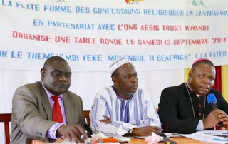 Imam Omar Kobine Layama (centre) shares a platform with Cardinal Dieudonné Nzapalainga (right) and Pastor Nicolas Guérékoyame-Gbangou at a PCRC event in Bangui, September 2014.