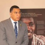 Andrew Holness - Prime Minister of Jamaica - visits the Kigali Genocide Memorial during CHOGM 2022