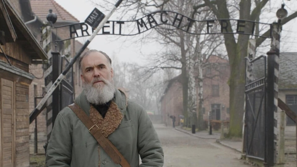 David Wilkinson at Auschwitz in the documentary Getting Away with Murder(s)