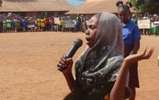 During a Bangui cultural week peace education workshop with the Aegis Trust Central African schoolchildren perform a sketch about the need for orphans to go to school