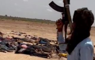 RSF guard unarmed black African men lying face down on the outskirts of Geneina, Darfur, June 2023