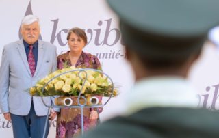 Romeo Dallaire and Marie-Claude Michaud lay a wreath at mass graves where 250000 victims of the Genocide against the Tutsi lie buried